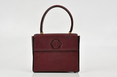 Lot 680 - CARTIER; a Must de Cartier 2C logo red...