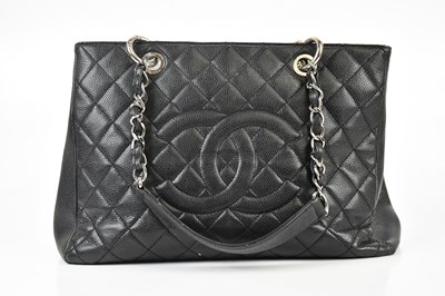 Lot 647 - CHANEL; a black caviar quilted leather Grand...