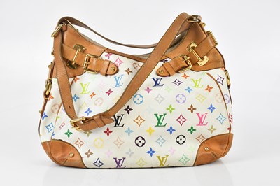 Lot 676 - LOUIS VUITTON; a white coated canvas...