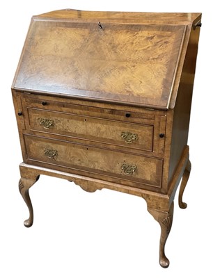 Lot 66 - A reproduction burr walnut bureau, with fall...