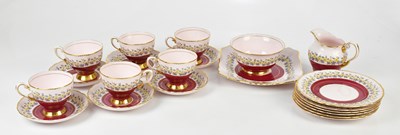 Lot 1698 - TUSCAN; a pink ground floral tea set,...