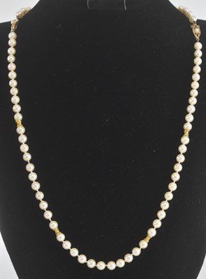 Lot 1430 - A single strand cultured pearl necklace, with...
