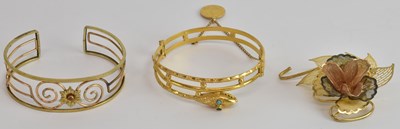 Lot 1198 - An Arabic yellow metal snap bangle modelled as...
