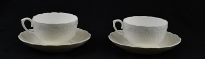 Lot 1700 - COALPORT; a pair of large white tea cups and...