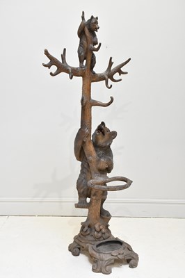 Lot 1307 - A late 19th century Black Forest carved bear...