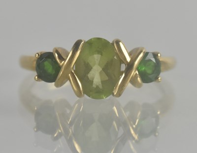 Lot 1333 - A 9ct gold peridot and diopside dress ring,...