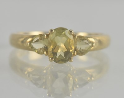 Lot 1334 - A 9ct gold dress ring with three graduated cut...