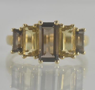Lot 1335 - A 9ct gold dress ring, with smoky quartz and...