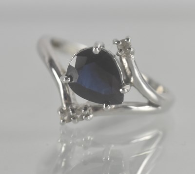 Lot 1278 - An 18ct white gold contemporary ring set with...