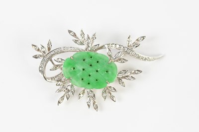 Lot 66 - A Chinese white metal diamond and jade brooch...