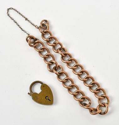 Lot 43 - A rose metal curb link bracelet, stamped '9C',...
