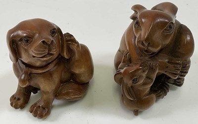 Lot 344 - Two Japanese carved boxwood netsuke, both...