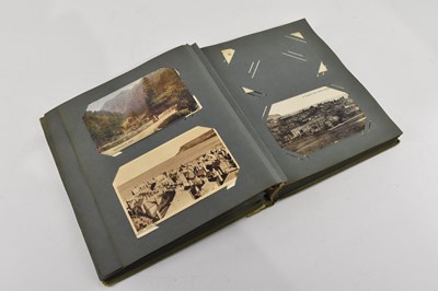 Lot 1806 - An early 20th century postcard album...