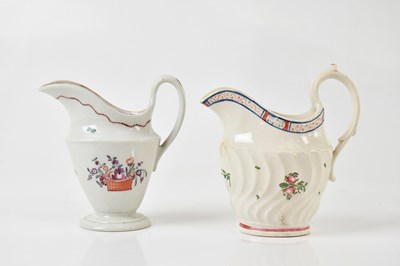 Lot 1665 - NEW HALL; two hand painted helmet shaped cream...