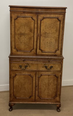 Lot 718 - A burr walnut drinks cabinet, with pull out...