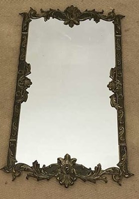 Lot 725 - A mirror with ornate baroque metal work edging,...