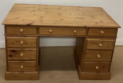 Lot 720 - A pine desk, with an arrangement of nine...