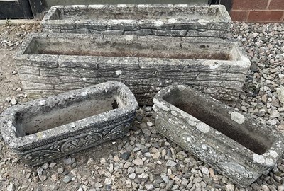 Lot 683 - Four composite stone planters, in the form of...