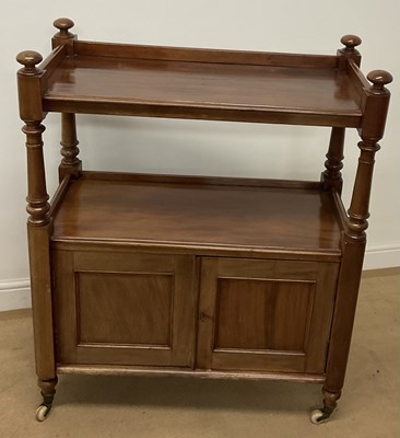 Lot 763 - An oak drinks trolley with cupboard doors, on...