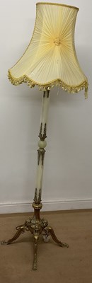 Lot 661 - An onyx stemmed standard lamp with ornate...