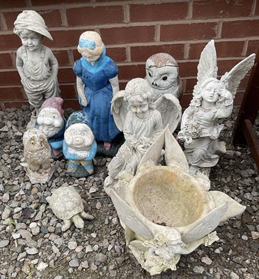 Lot 686 - A group of painted composite stone garden...
