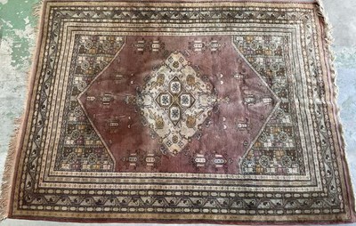 Lot 664 - A European machine woven rug, with large...