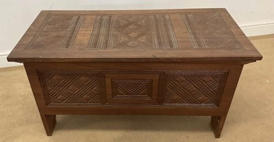 Lot 743 - A teak blanket box with carved decoration, 48...