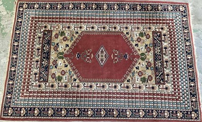 Lot 665 - A European machine woven rug, a rectangular...