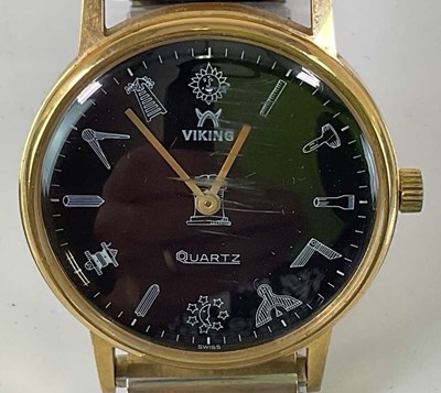 Lot 606 - MASONIC INTEREST; a gentleman's quartz gold...