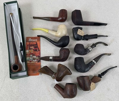 Lot 25 - A collection of various pipes, three with...