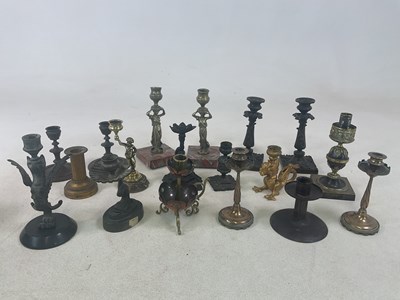 Lot 191 - An interesting collection of candlesticks...