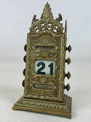 Lot 65 - A circa 1900 brass perpetual calendar, with...