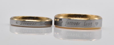 Lot 490 - A pair of wedding bands, inscribed 'Forever...