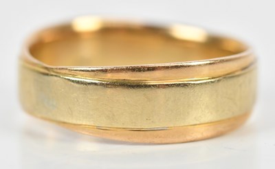 Lot 351 - A yellow metal wedding band, stamped '750',...
