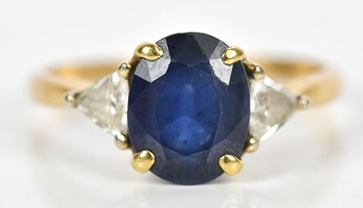 Lot 335 - A yellow metal diamond and sapphire three...