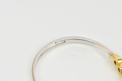 Lot 21 - A yellow and white metal diamond set hinged...