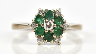 Lot 377 - A white metal diamond and emerald set daisy...
