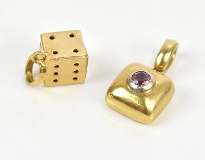 Lot 8 - A yellow metal dice charm, stamped '750',...