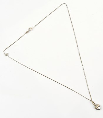 Lot 264 - A white metal heart shaped pendant, suspended...