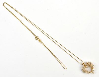Lot 226 - A yellow metal heart shaped diamond set...