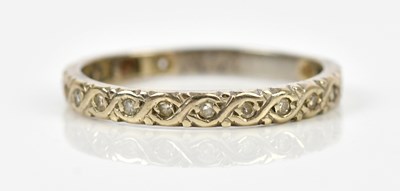 Lot 489 - A white metal diamond set eternity ring, size...