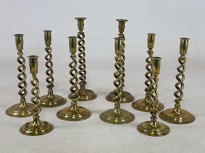Lot 196 - A set of six 19th century brass candlesticks...