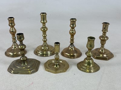 Lot 208 - Seven 18th century brass candlesticks,...