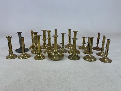 Lot 195 - A collection of brass ejector candlesticks,...
