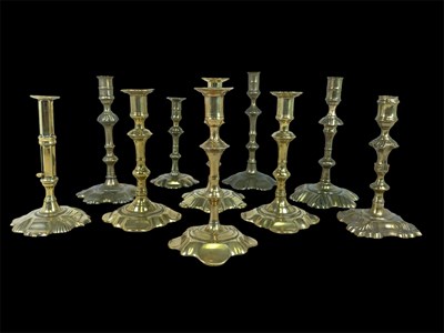 Lot 171 - A pair of 18th century brass petal foot...