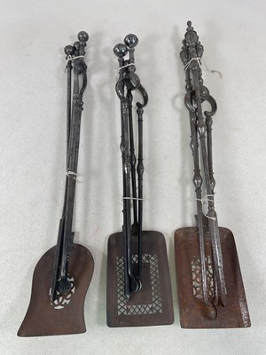 Lot 242 - Three sets of Georgian steel fire irons,...