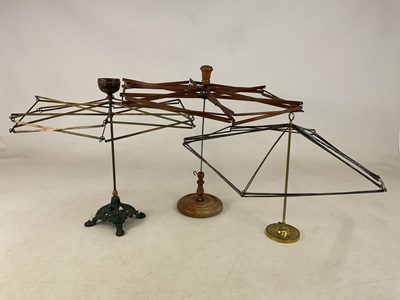 Lot 79 - Three wool winders. One all wood example and a...
