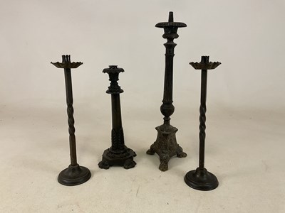 Lot 248 - A pair of forged decorative candlesticks,...