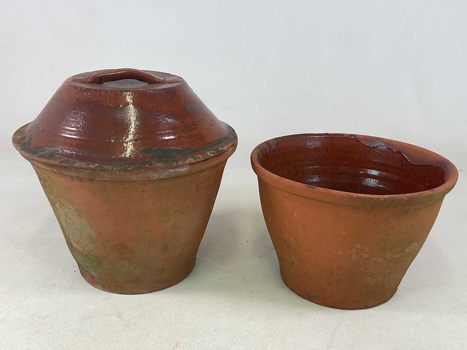 Lot 289 - A large terracotta crockpot with lid and...