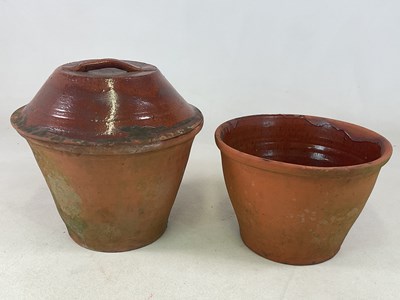 Lot 289 - A large terracotta crockpot with lid and...